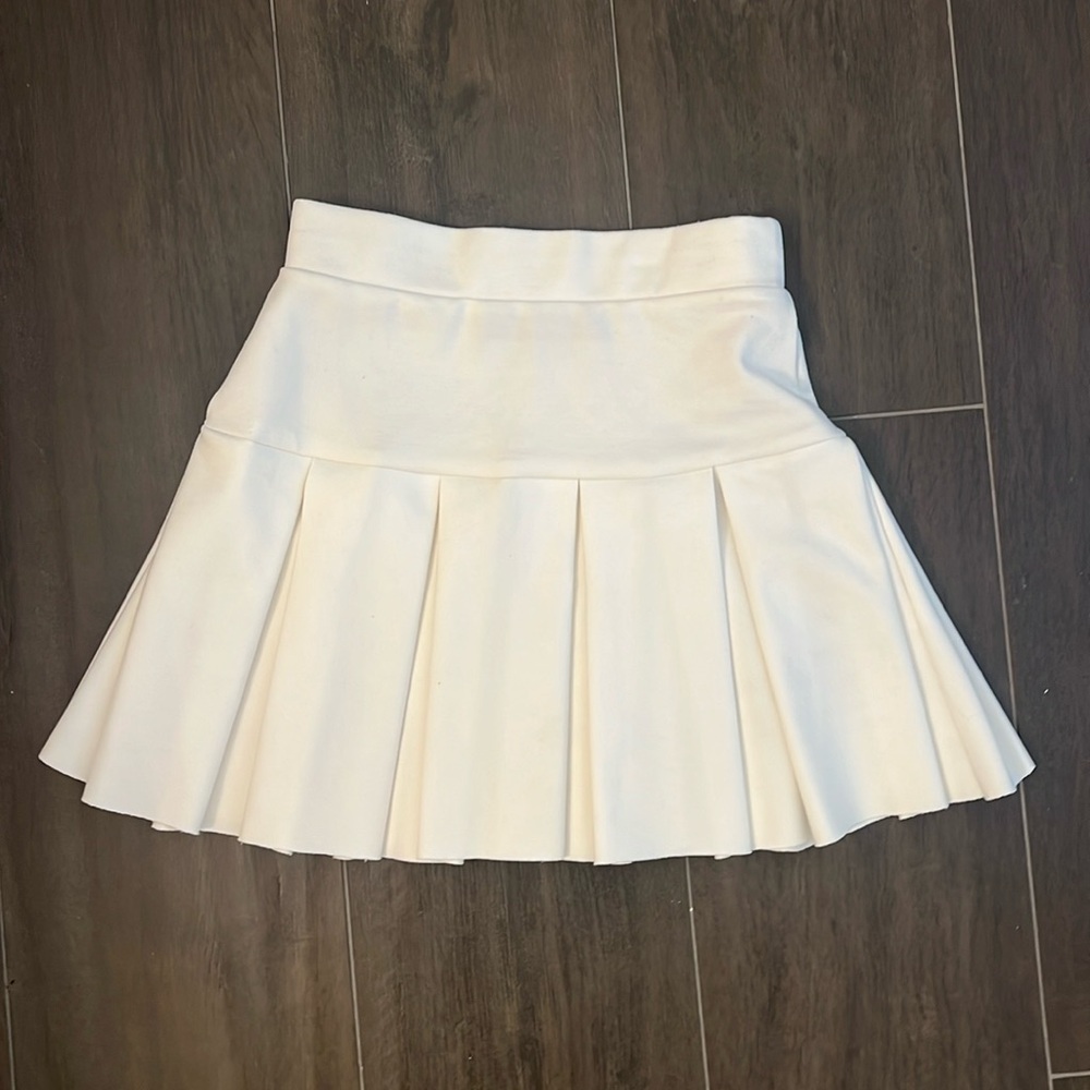Lioness pleated tennis skirt
